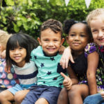 Child using a tablet for online learning in early years setting