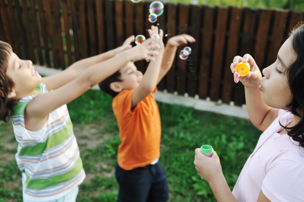 Children playing outdoors in an early years setting